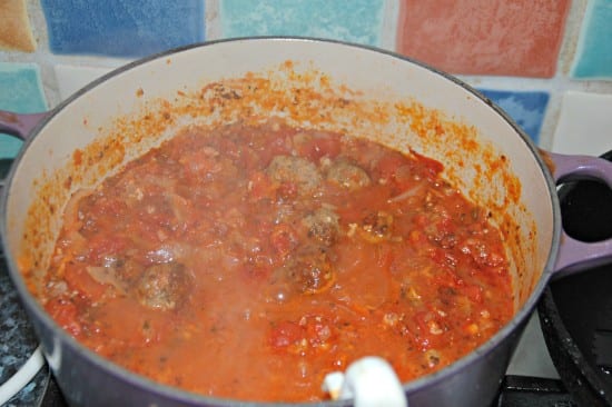 Red ragu and meatballs simmering