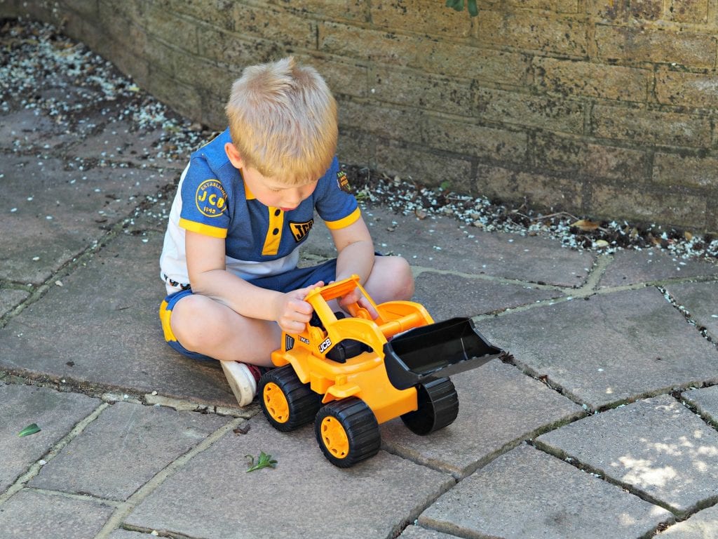  JCB Kids M&Co Shorts and Polo Shirt - Logan playing with digger 2
