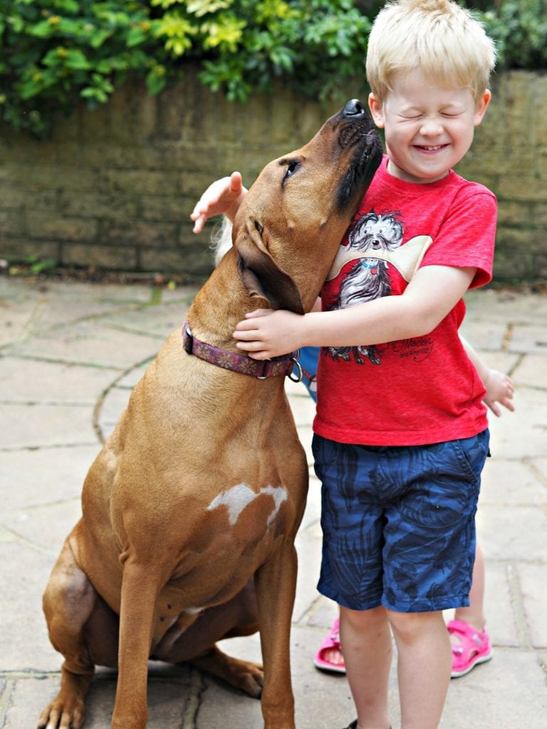 Looking After Your Dog's Teeth with Pedigree Chum Dentastix - Florence kissing Logan