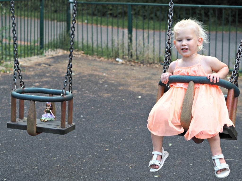 Lottie Doll on the swings