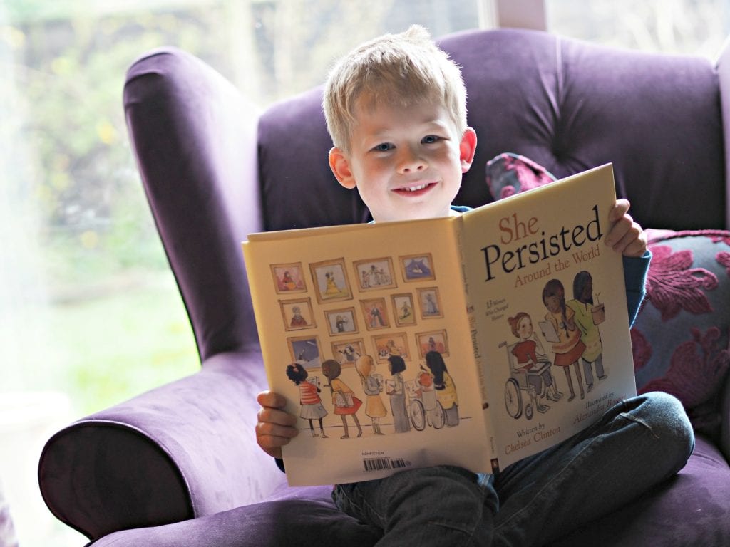 CHILDREN'S BOOK REVIEW She Persisted Around the World - Logan with the book