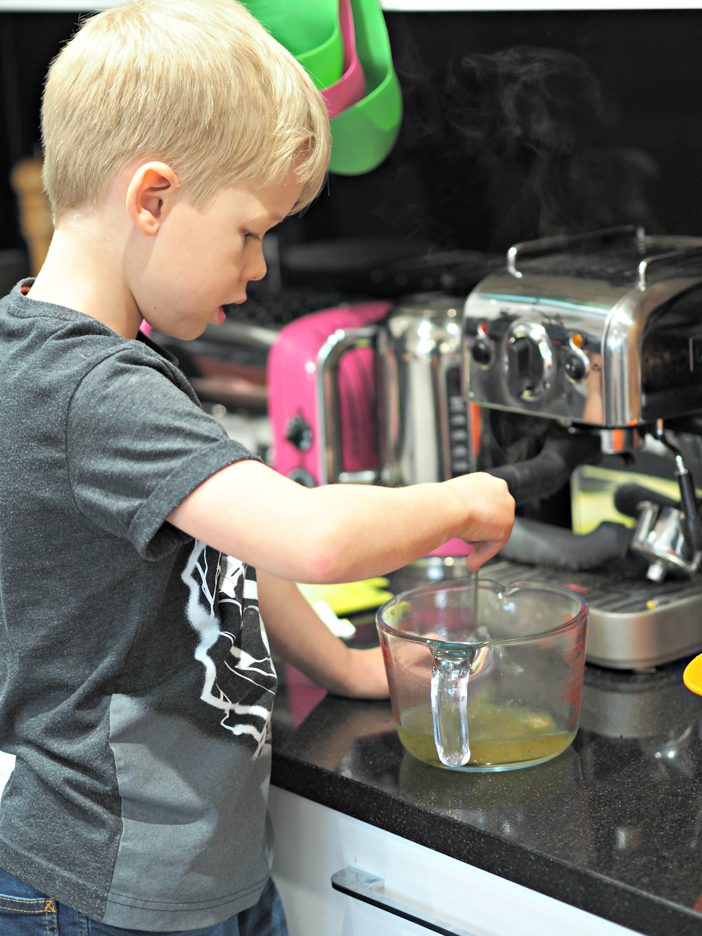 Healthy Halloween Making Pumpkin Coconut Soup with Aldi - Logan mixing