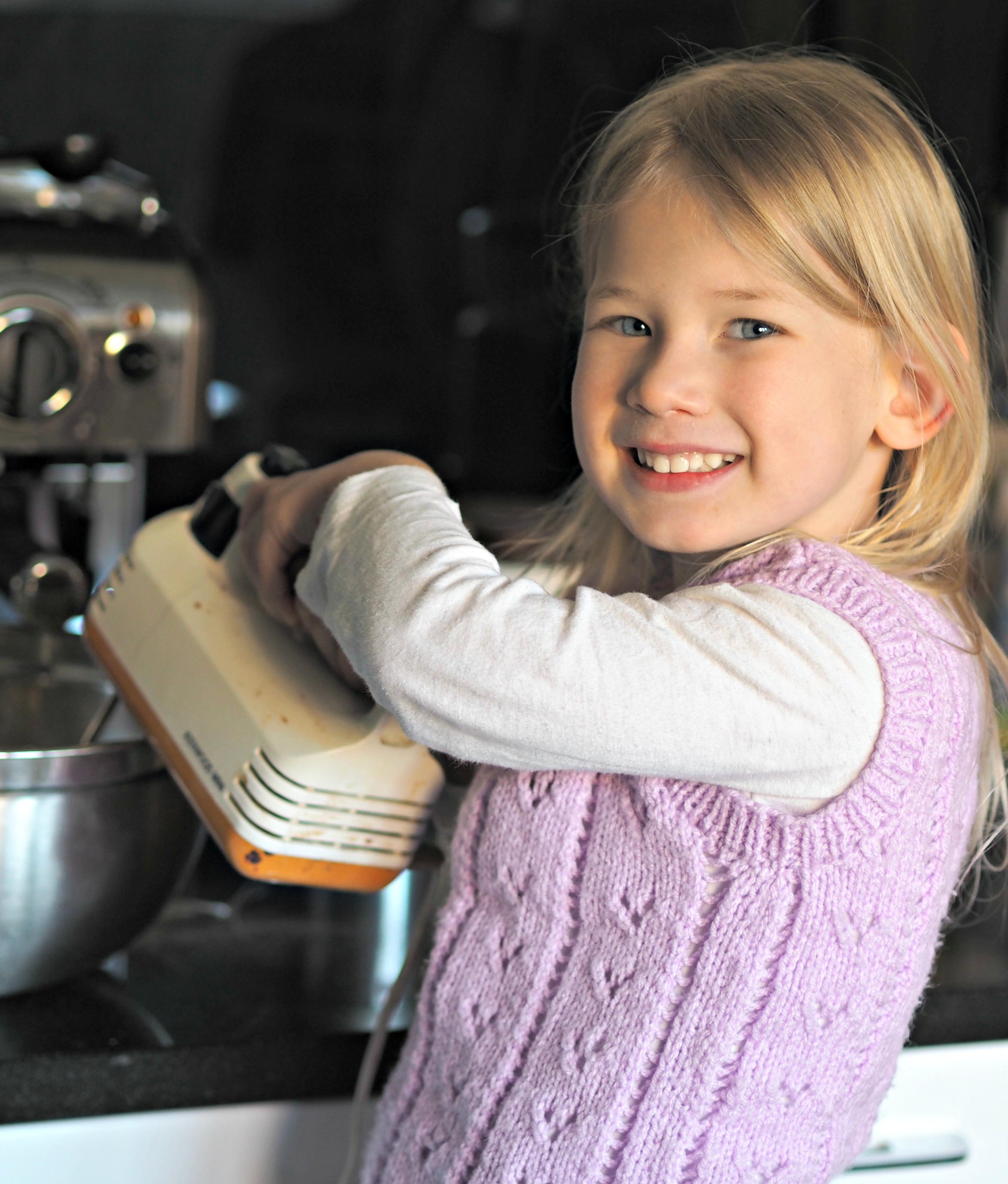 Aria mixing the cake mixture