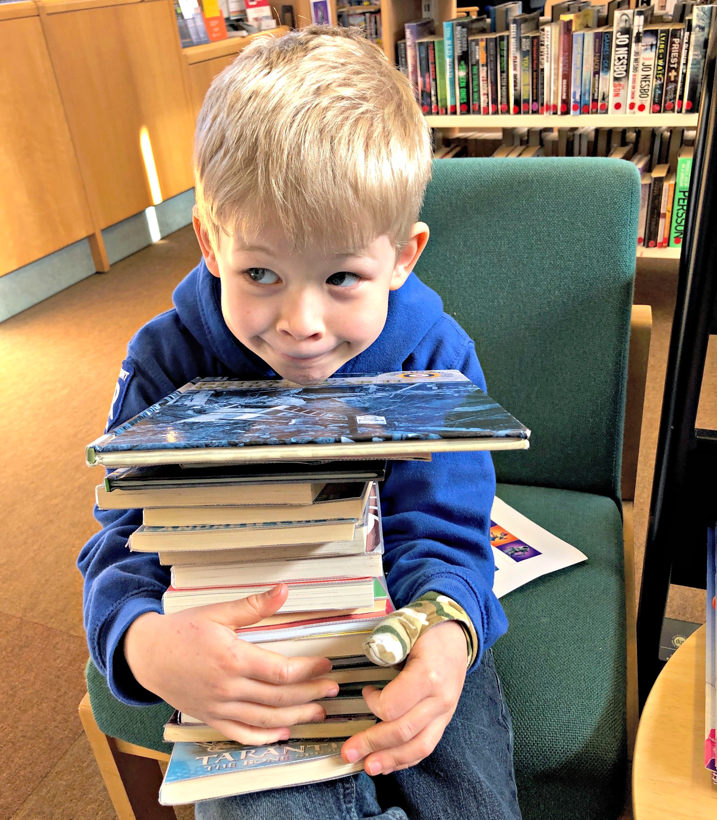 Logan pile of books