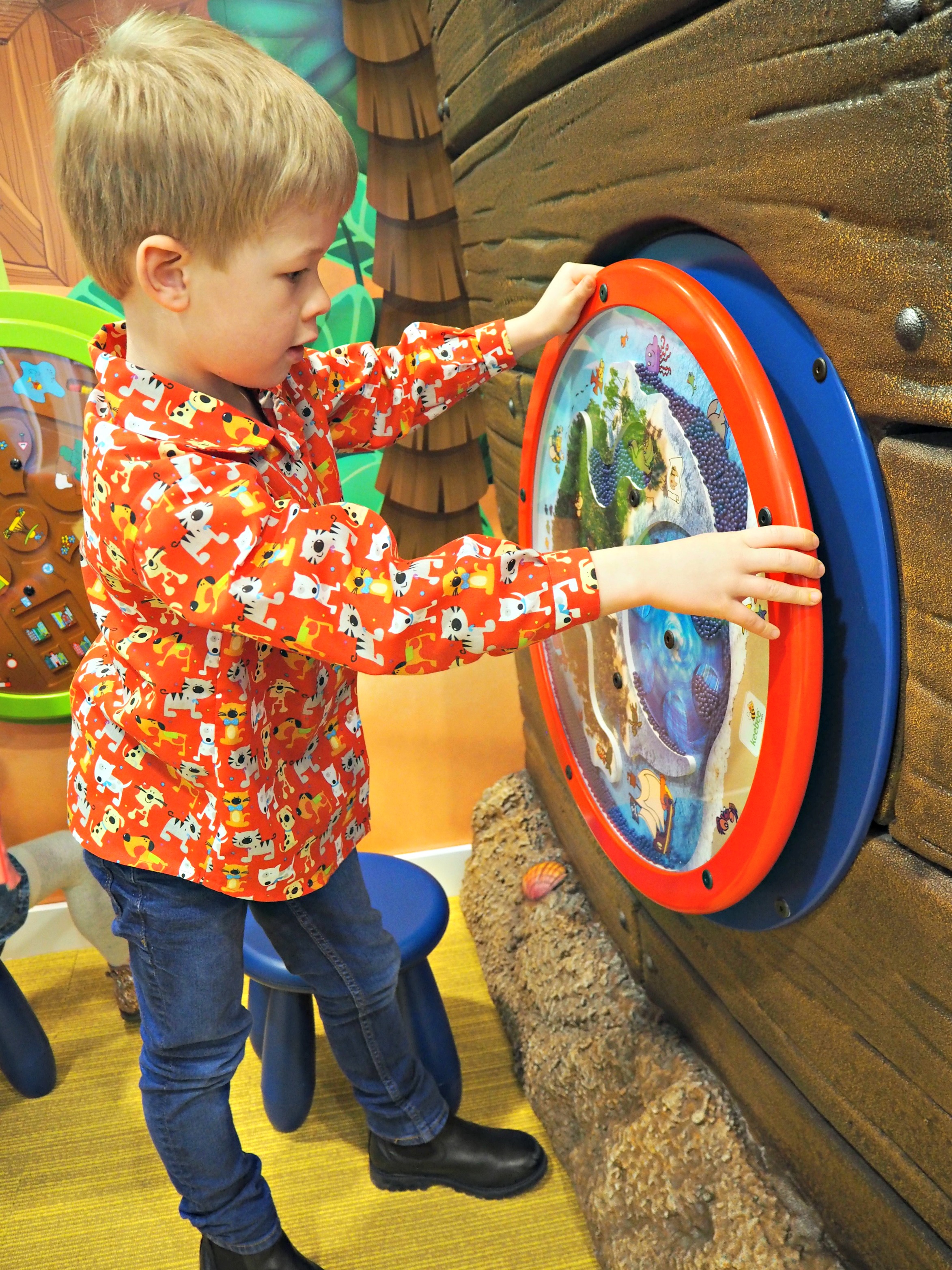 Playing in Happy Kids Dental Waiting Room