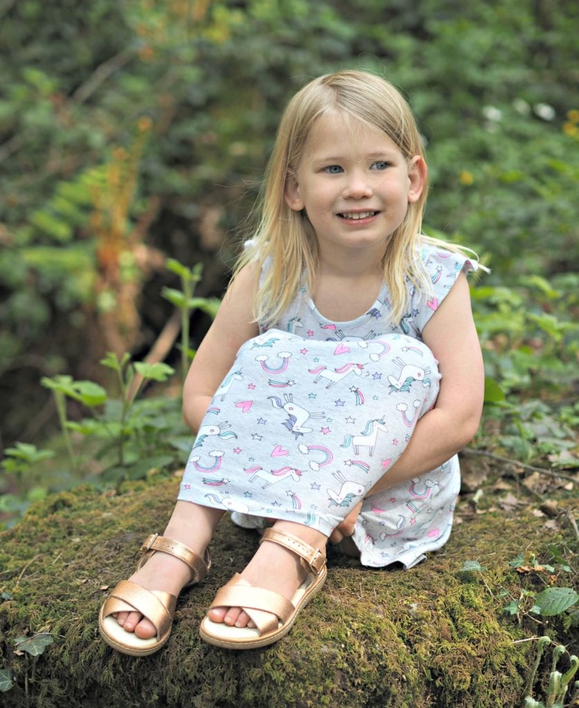 To my Daughter on her 5th Birthday - Aria sitting on a mossy rock