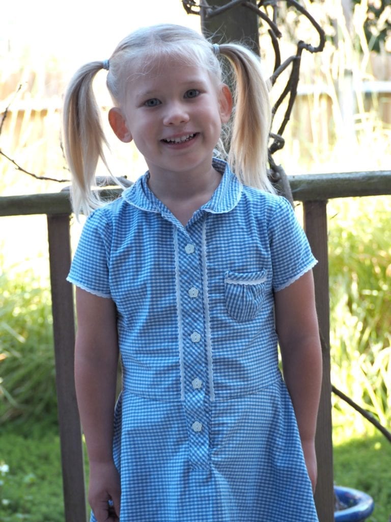 Aria's First Year of School - Aria in a check blue school with bunches in her hair