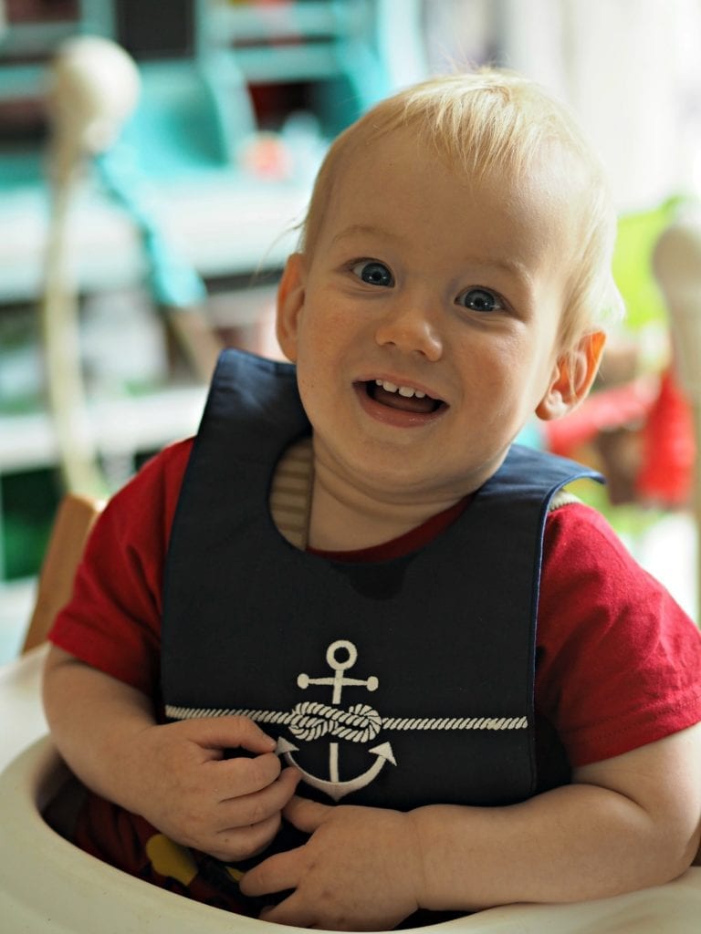 Bodhi wearing Poppie and George bib