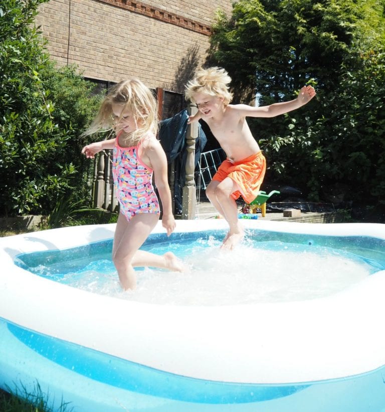 Free or Cheap Things to do in the Summer Holidays - Aria and Logan playing in the paddling pool