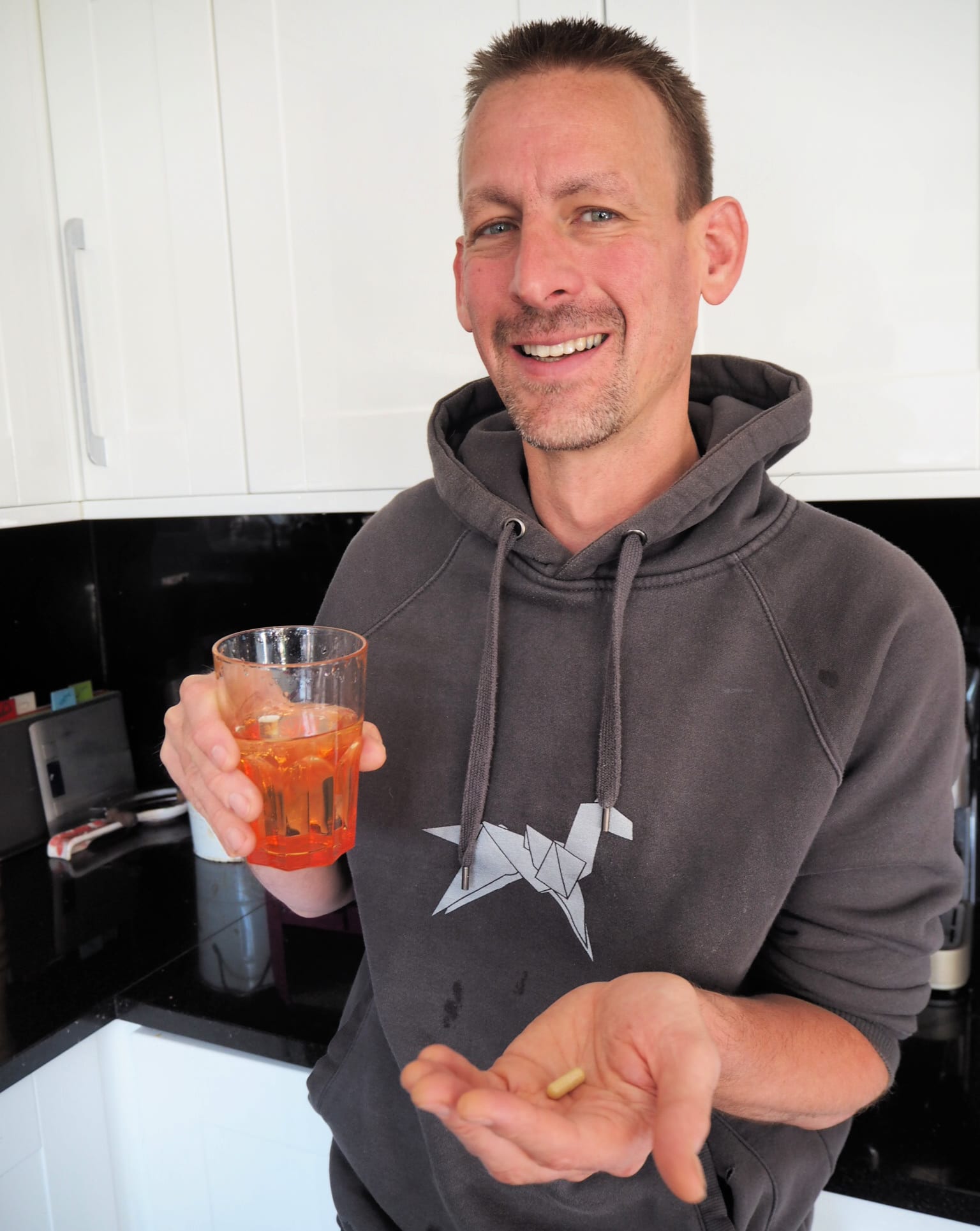 Ben with the supplements on his hand