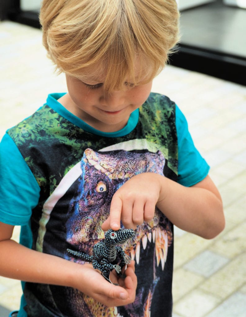 Logan holding mini dinosaur