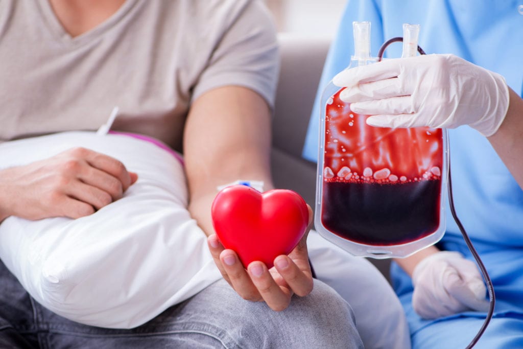 Patient getting blood transfusion in hospital clinic