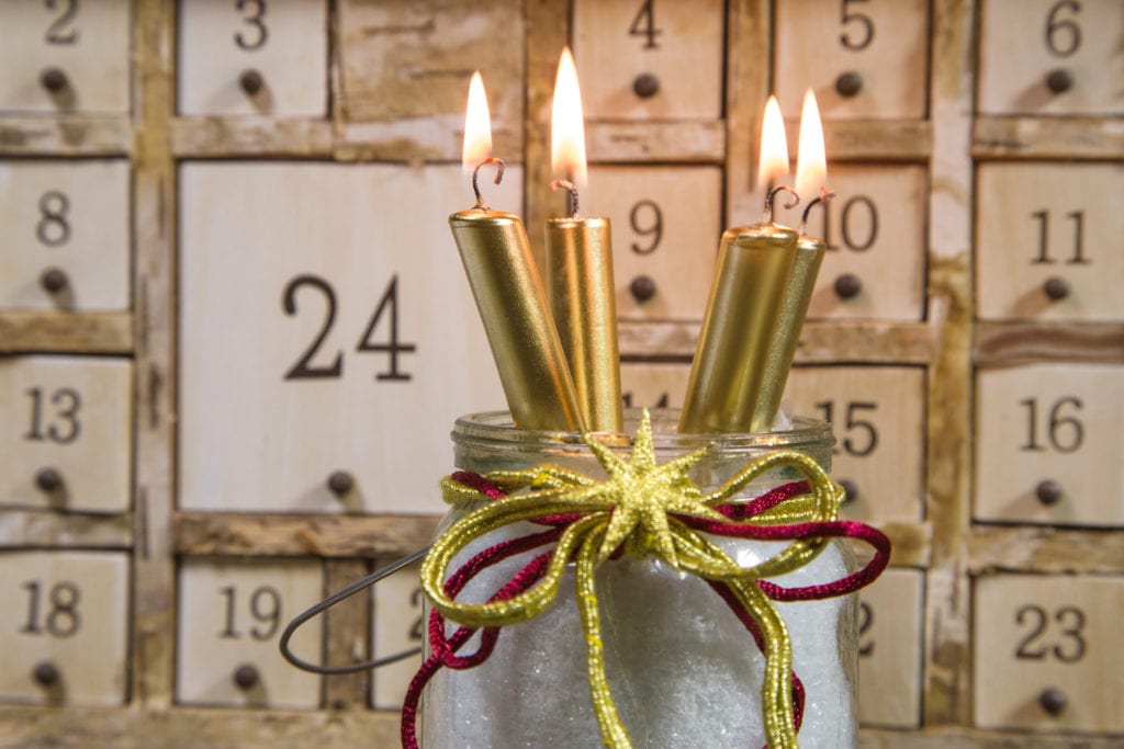 Shabby chic advents calendar with four gold burning candles - atmospheric for christmas