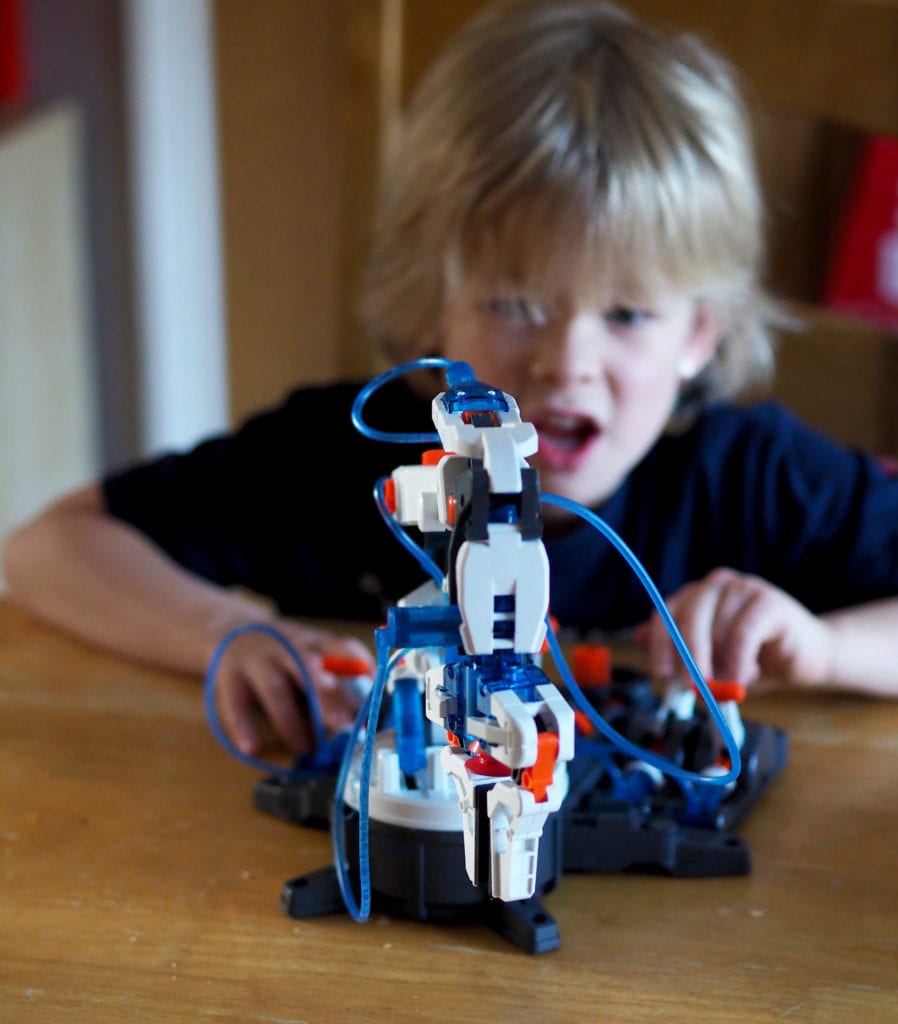 Hydraulic Robot Arm Review Logan playing with arm on table