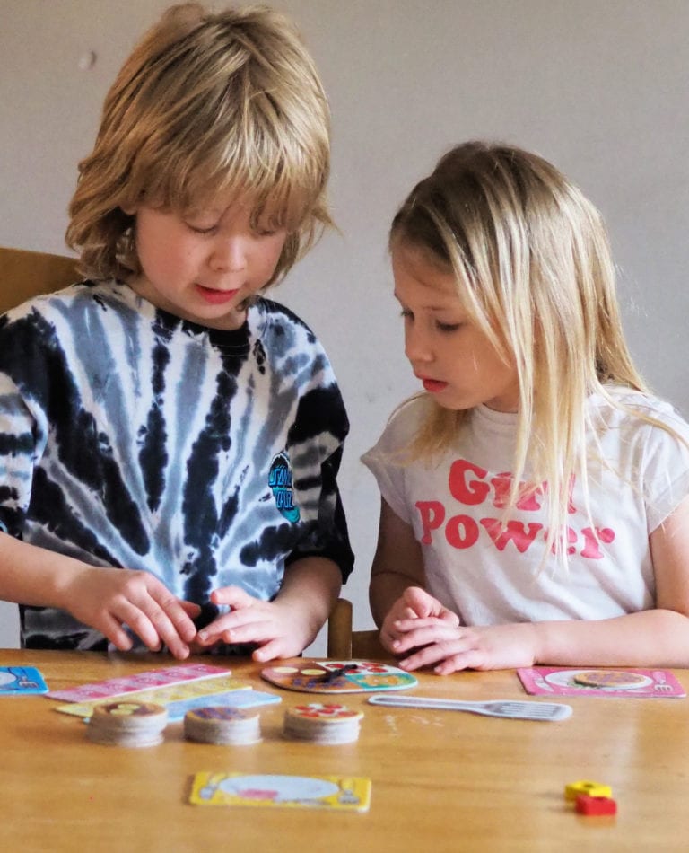 Aria and Logan playing times tables board game