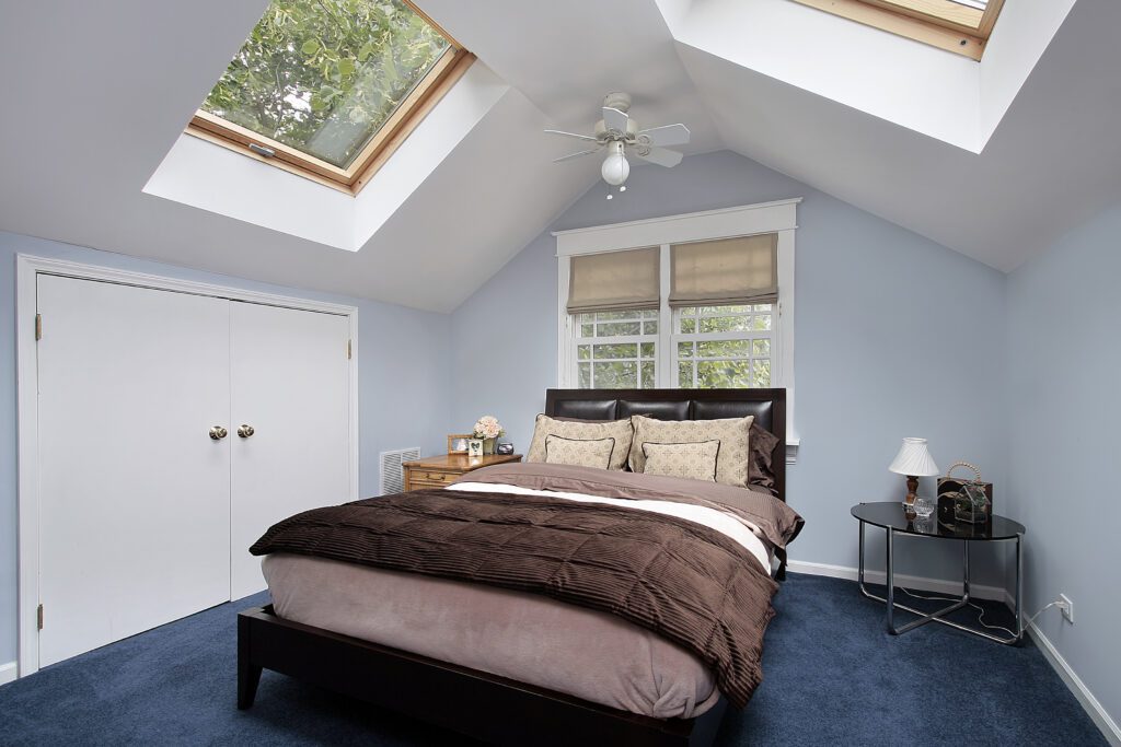 Master bedroom in suburban home with skylights